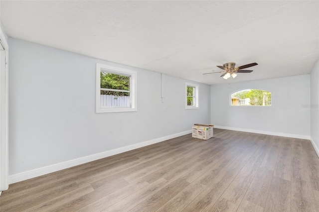 14761 SW 35th Terrace Rd, Ocala, FL 34473 - empty room with wood finished floors and a ceiling fan