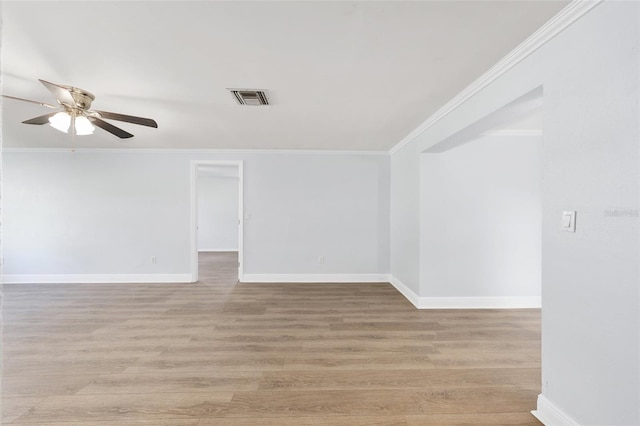 14761 SW 35th Terrace Rd, Ocala, FL 34473 - spare room featuring a ceiling fan, crown molding, and light wood-style floors