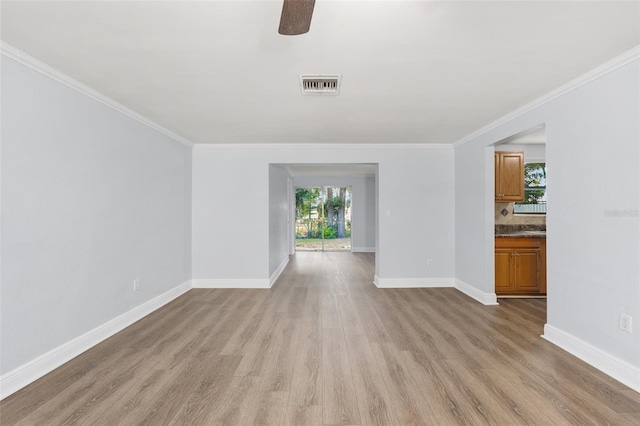 14761 SW 35th Terrace Rd, Ocala, FL 34473 - empty room with light wood-type flooring, healthy amount of natural light, crown molding, and ceiling fan