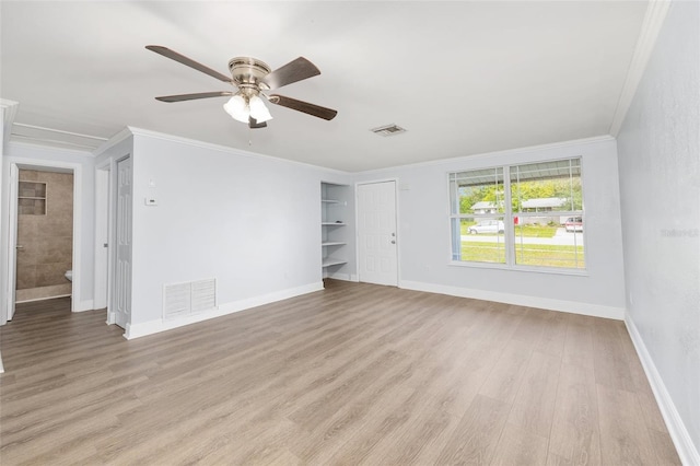 14761 SW 35th Terrace Rd, Ocala, FL 34473 - unfurnished room featuring light wood-style flooring, crown molding, ceiling fan, and built in features