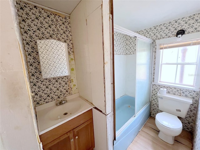 23161 NE 155th Ct, Fort Mc Coy, FL 32134 - bathroom featuring vanity, wallpapered walls, and combined bath / shower with glass door