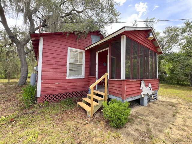 23161 NE 155th Ct, Fort Mc Coy, FL 32134 - view of front facade with a sunroom