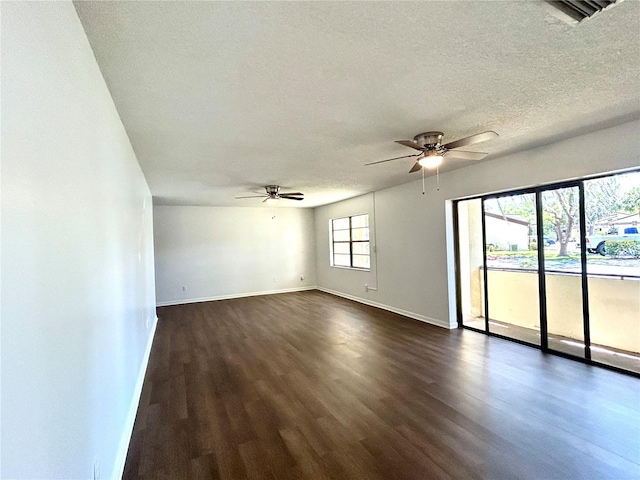 3525 E Fort King St Unit 145, Ocala, FL 34470 - empty room with dark wood finished floors, a ceiling fan, and a textured ceiling