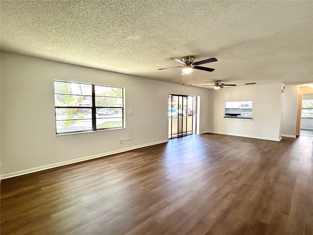 3525 E Fort King St Unit 145, Ocala, FL 34470 - unfurnished living room featuring a textured ceiling, ceiling fan, and dark wood-style flooring