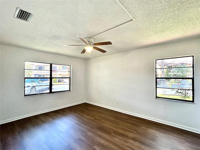 3525 E Fort King St Unit 145, Ocala, FL 34470 - unfurnished room featuring dark wood finished floors, ceiling fan, and a textured ceiling