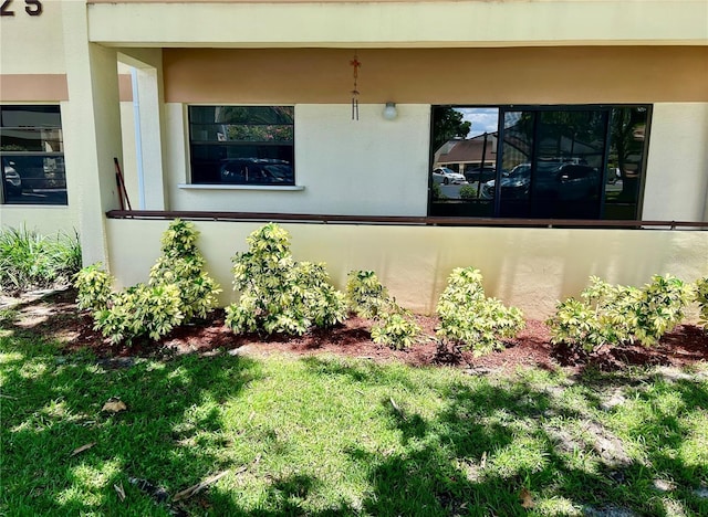 3525 E Fort King St Unit 145, Ocala, FL 34470 - exterior space featuring stucco siding and a lawn