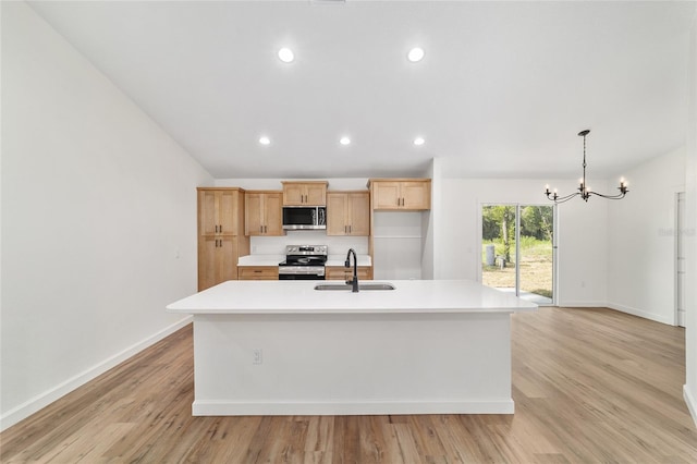 5400 NW 9th St, Ocala, FL 34482 - kitchen with stainless steel appliances, light countertops, a chandelier, a kitchen island with sink, and recessed lighting