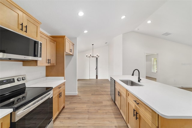 5400 NW 9th St, Ocala, FL 34482 - kitchen featuring stainless steel appliances, a chandelier, lofted ceiling, light brown cabinets, and light wood-type flooring
