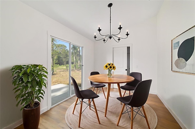 5400 NW 9th St, Ocala, FL 34482 - dining area featuring a chandelier and light wood finished floors