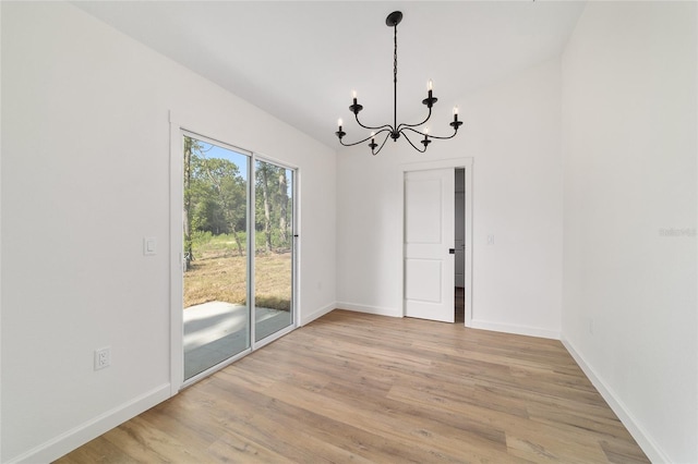 5400 NW 9th St, Ocala, FL 34482 - unfurnished dining area with a chandelier and light wood-type flooring