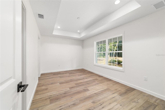 5400 NW 9th St, Ocala, FL 34482 - spare room featuring recessed lighting, a raised ceiling, and light wood-style flooring