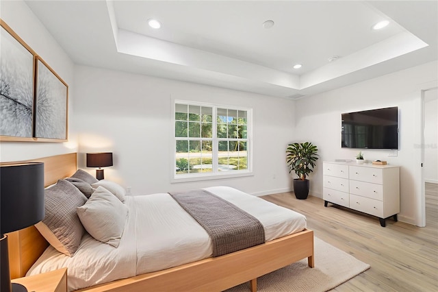 5400 NW 9th St, Ocala, FL 34482 - bedroom featuring a raised ceiling, light wood-style flooring, and recessed lighting