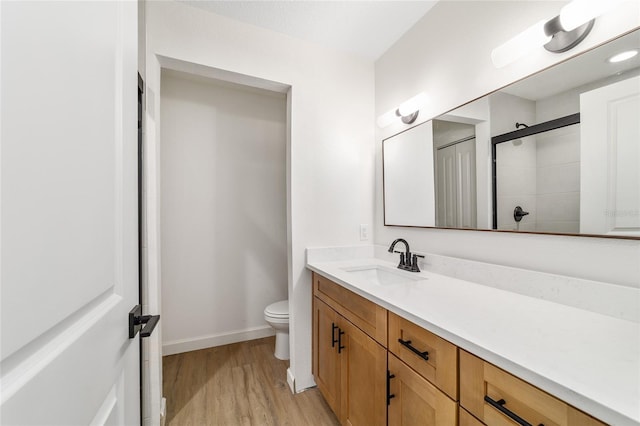 5400 NW 9th St, Ocala, FL 34482 - full bath featuring vanity, wood finished floors, and a tile shower