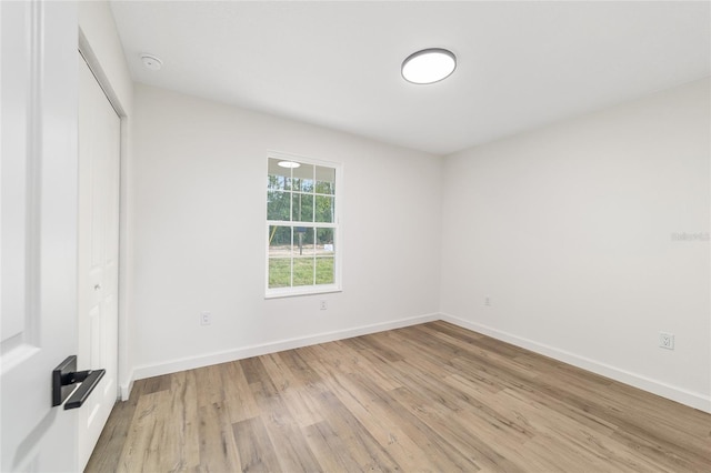 5400 NW 9th St, Ocala, FL 34482 - unfurnished bedroom featuring light wood-style floors and a closet