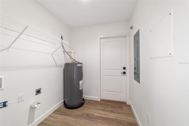5400 NW 9th St, Ocala, FL 34482 - laundry area featuring electric water heater, hookup for an electric dryer, wood finished floors, and electric panel