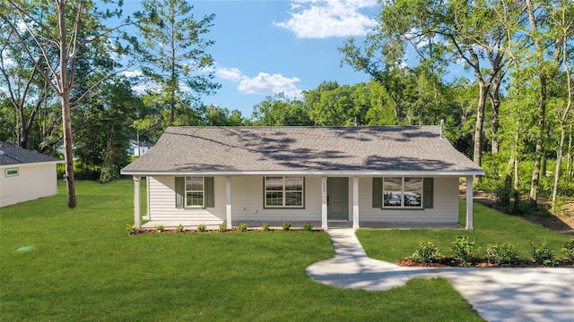 5400 NW 9th St, Ocala, FL 34482 - view of front facade with covered porch, a front yard, and roof with shingles