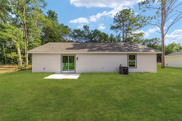 5400 NW 9th St, Ocala, FL 34482 - rear view of property with a yard, a patio area, and a shingled roof