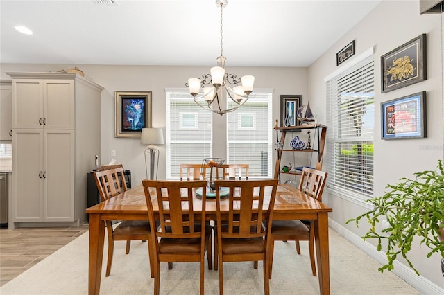 4340 NW 56th Ct, Ocala, FL 34482 - dining area with a chandelier and light wood finished floors