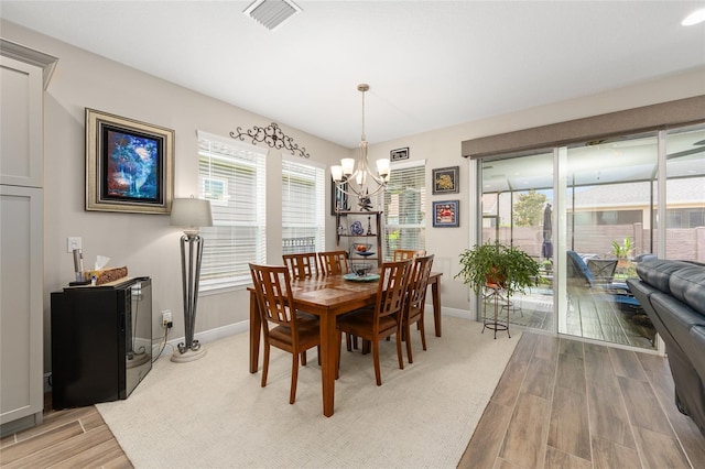 4340 NW 56th Ct, Ocala, FL 34482 - dining space featuring a chandelier and light wood finished floors