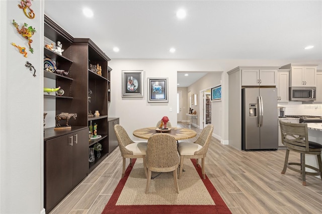 4340 NW 56th Ct, Ocala, FL 34482 - dining area with light wood-style flooring and recessed lighting