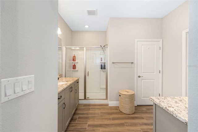 4340 NW 56th Ct, Ocala, FL 34482 - full bathroom featuring vanity, wood finish floors, a stall shower, and recessed lighting