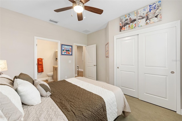 4340 NW 56th Ct, Ocala, FL 34482 - bedroom featuring light carpet, a closet, ensuite bathroom, and a ceiling fan