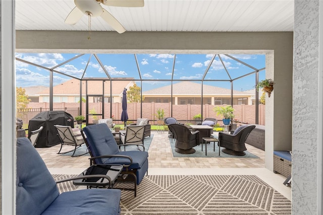 4340 NW 56th Ct, Ocala, FL 34482 - fenced backyard featuring a patio, grilling area, a ceiling fan, and a lanai