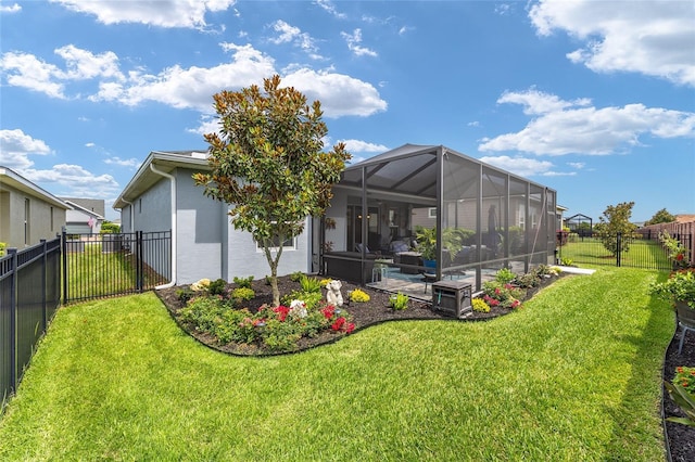 4340 NW 56th Ct, Ocala, FL 34482 - rear view of house with a fenced backyard, stucco siding, and glass enclosure