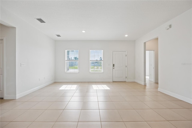 15212 SW 27th Ct, Ocala, FL 34473 - empty room with recessed lighting and light tile patterned floors