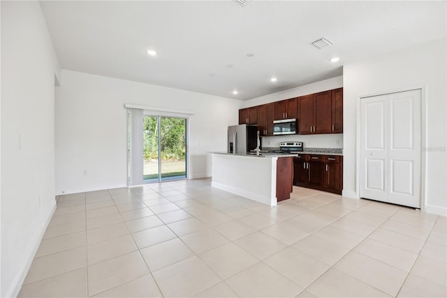 15212 SW 27th Ct, Ocala, FL 34473 - kitchen featuring stainless steel appliances, open floor plan, recessed lighting, a center island with sink, and light tile patterned floors