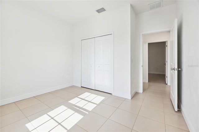 15212 SW 27th Ct, Ocala, FL 34473 - unfurnished bedroom with light tile patterned flooring and a closet