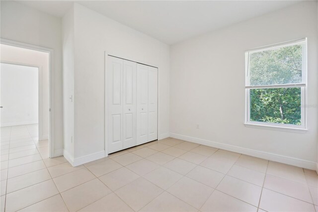 15212 SW 27th Ct, Ocala, FL 34473 - unfurnished bedroom featuring light tile patterned floors and a closet