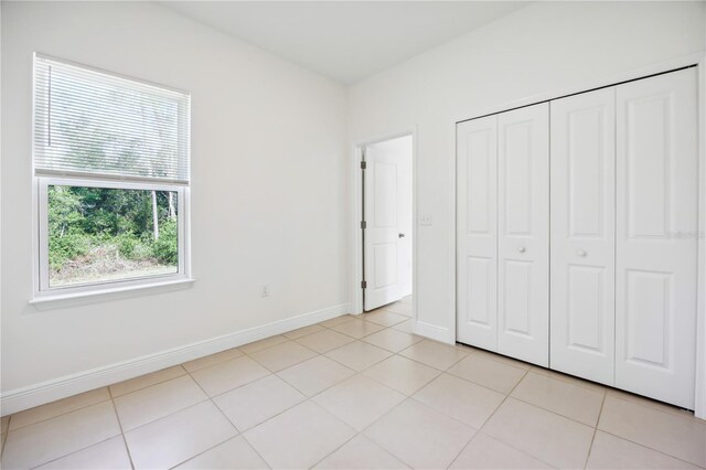 15212 SW 27th Ct, Ocala, FL 34473 - unfurnished bedroom with light tile patterned floors and a closet