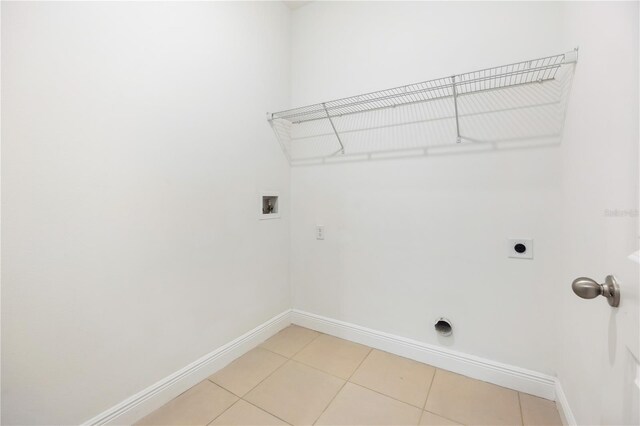 15212 SW 27th Ct, Ocala, FL 34473 - laundry room featuring hookup for an electric dryer, hookup for a washing machine, and light tile patterned floors