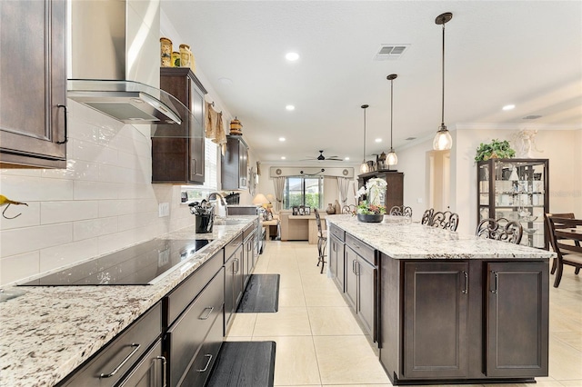 9634 SW 67th St, Ocala, FL 34481 - kitchen with wall chimney range hood, black electric cooktop, open floor plan, decorative backsplash, and dark brown cabinets