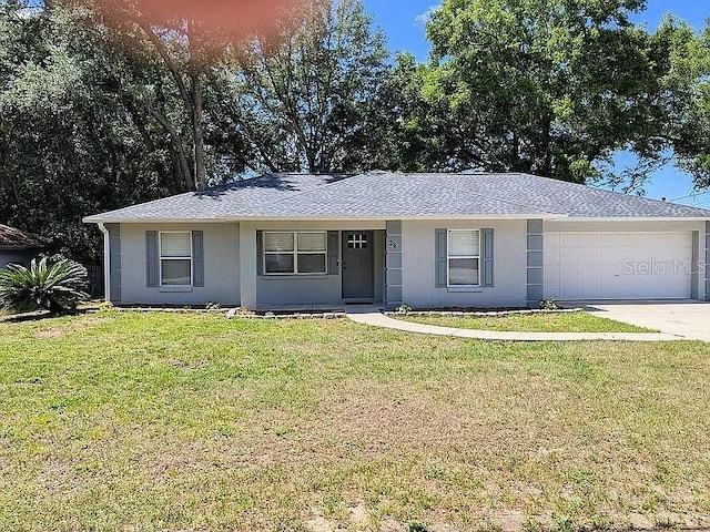 26 Hemlock Terrace Dr, Ocala, FL 34472 - single story home with a garage, stucco siding, a front lawn, driveway, and a shingled roof