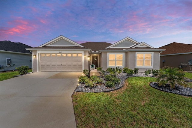 4416 Homan Loop, The Villages, FL 32163 - ranch-style home featuring concrete driveway, stucco siding, an attached garage, and a yard