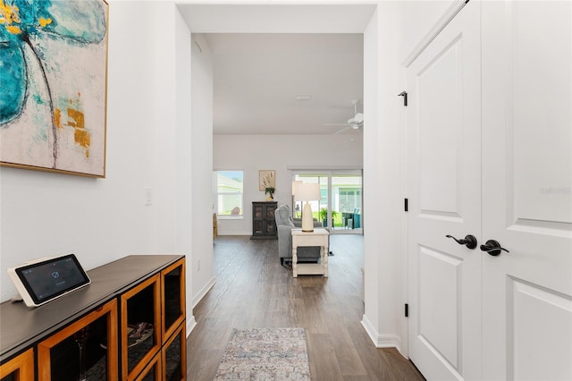 4416 Homan Loop, The Villages, FL 32163 - hallway with dark wood finished floors and baseboards