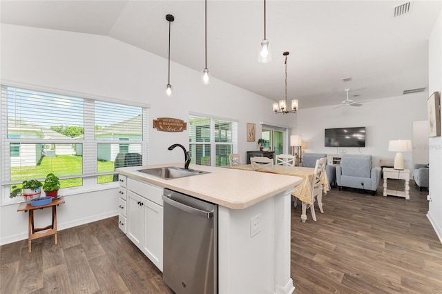 4416 Homan Loop, The Villages, FL 32163 - kitchen featuring dishwasher, open floor plan, healthy amount of natural light, lofted ceiling, and white cabinetry