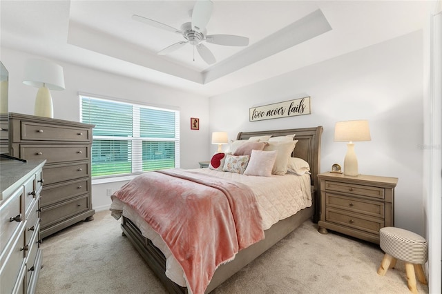 4416 Homan Loop, The Villages, FL 32163 - bedroom featuring light carpet, a raised ceiling, and a ceiling fan