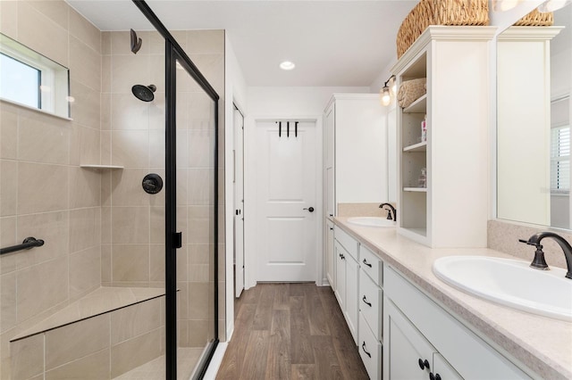 4416 Homan Loop, The Villages, FL 32163 - full bathroom featuring a stall shower, double vanity, wood finished floors, and recessed lighting