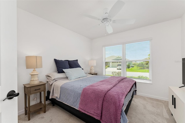 4416 Homan Loop, The Villages, FL 32163 - bedroom with light carpet and ceiling fan