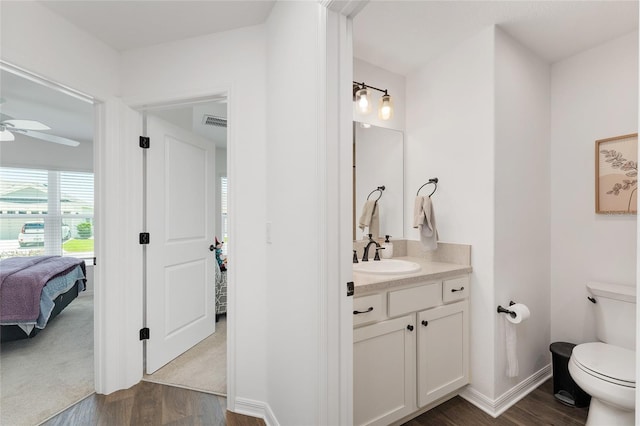4416 Homan Loop, The Villages, FL 32163 - bathroom featuring wood finished floors, vanity, ceiling fan, and ensuite bathroom