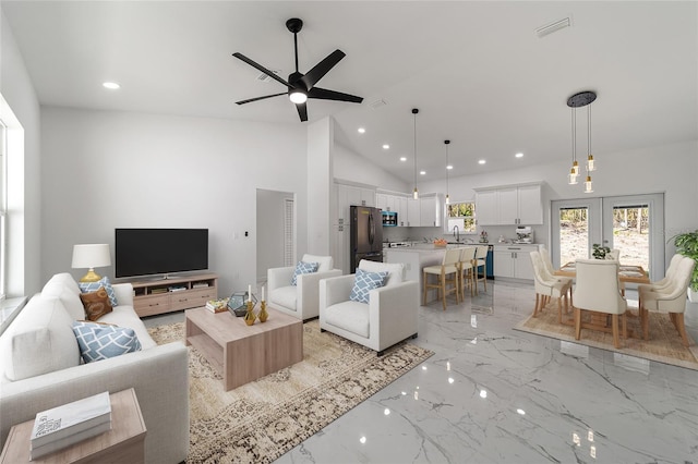 13741 SW 81st Cir, Ocala, FL 34473 - living room with light marble finish floors, a ceiling fan, french doors, recessed lighting, and high vaulted ceiling