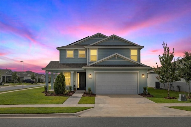 7695 SW 64th Street Rd, Ocala, FL 34474 - view of front of house with a front yard, concrete driveway, a shingled roof, and a garage