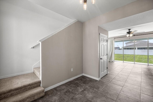7695 SW 64th Street Rd, Ocala, FL 34474 - stairs featuring a ceiling fan and tile patterned flooring