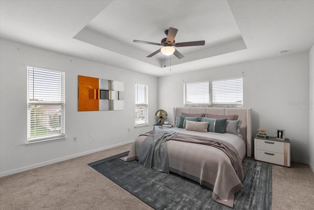 7695 SW 64th Street Rd, Ocala, FL 34474 - carpeted bedroom with a tray ceiling and ceiling fan