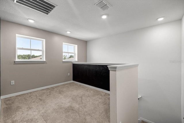 7695 SW 64th Street Rd, Ocala, FL 34474 - unfurnished room with carpet flooring, recessed lighting, and a textured ceiling