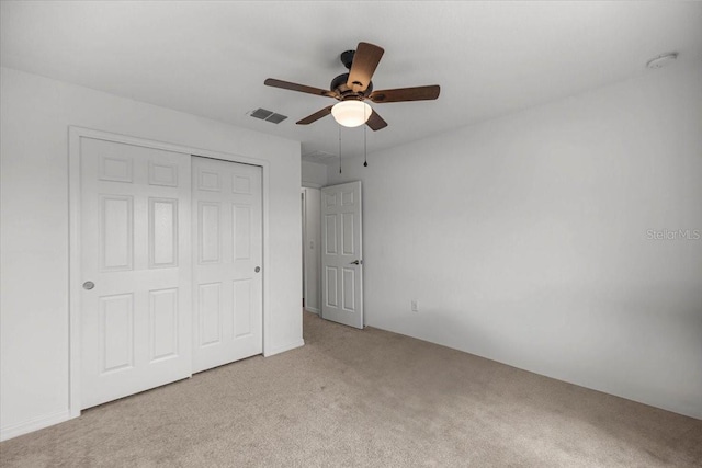 7695 SW 64th Street Rd, Ocala, FL 34474 - unfurnished bedroom with carpet flooring, a closet, and ceiling fan