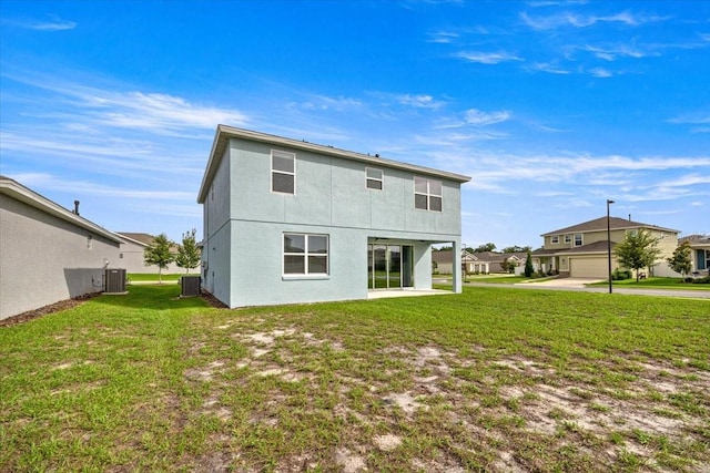 7695 SW 64th Street Rd, Ocala, FL 34474 - back of property featuring a yard and stucco siding
